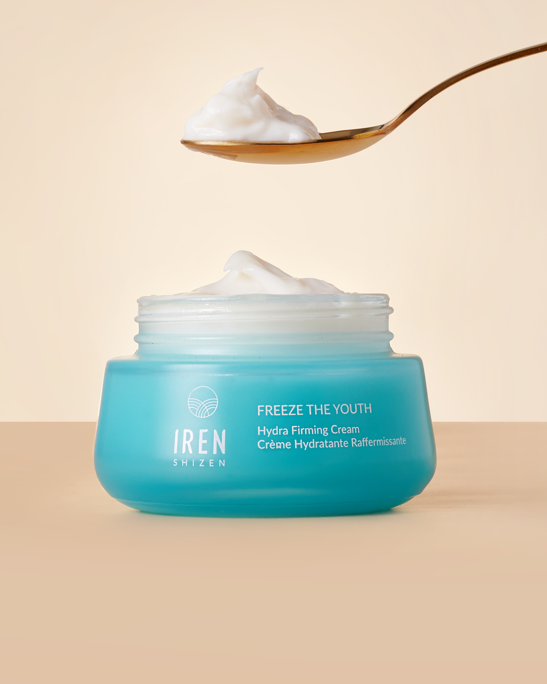 A spoon over a jar of FREEZE THE YOUTH Hydra Firming Cream from IREN Shizen. #all-groups
