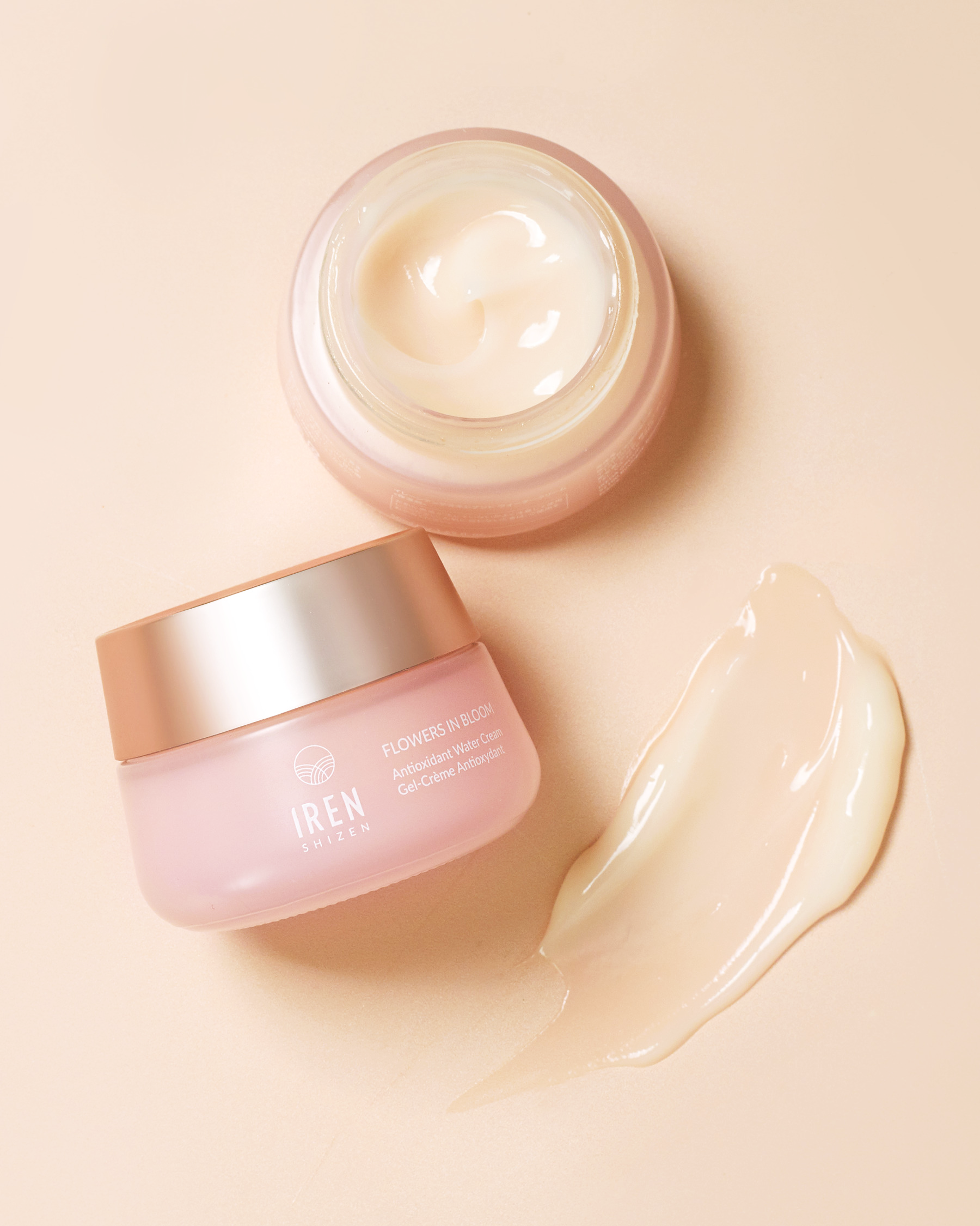 A FLOWERS IN BLOOM Antioxidant Water Cream in a jar and a FLOWERS IN BLOOM Antioxidant Water Cream smear. all-groups