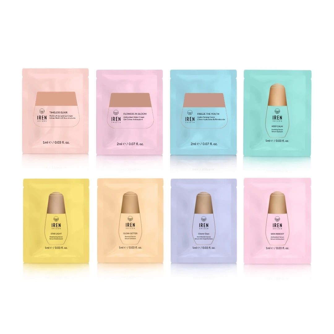 Eight pastel-colored sachets from IREN Shizen are arranged in two rows—a perfect 8 Sachets Gift Pack for those seeking personalized or anti-aging skincare routines.