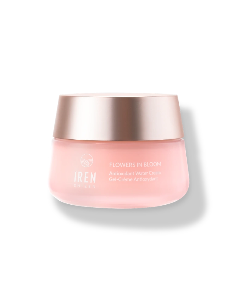 A pink jar of IREN Shizen FLOWERS IN BLOOM Antioxidant Water Cream, a hydrating gel cream with a gold lid, sits on a light background—your new go-to for natural skincare.