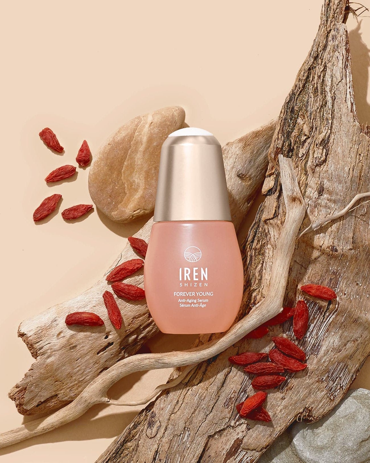 A bottle of customised FOREVER YOUNG Anti-Aging Serum by IREN Shizen, inspired by Japanese skincare, on a beige background. #all-groups