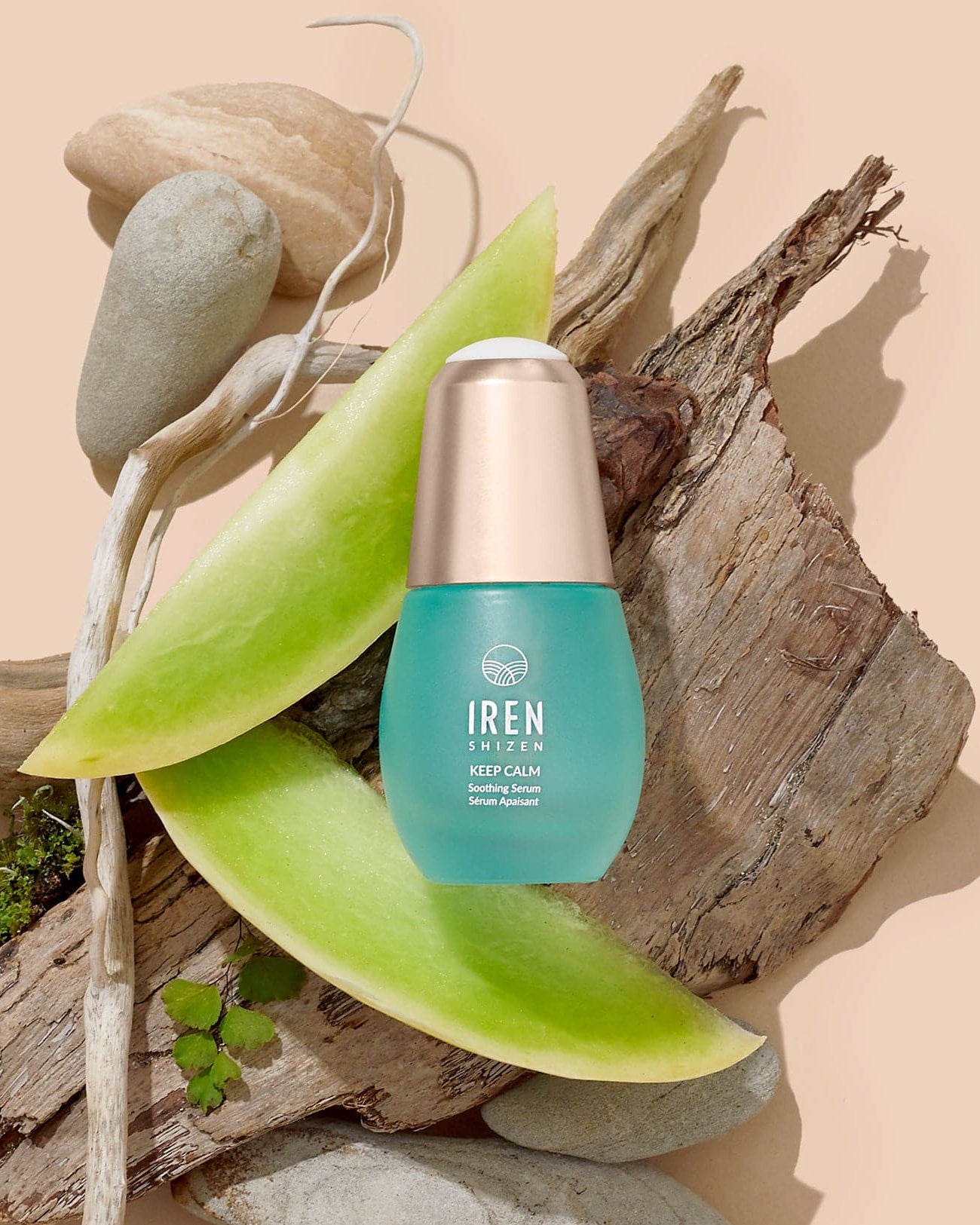 A bottle of Japanese skincare Soothing Serum by IREN Shizen on a piece of wood. #all-groups