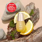 A bottle of STAR LIGHT Brightening Serum by IREN Shizen is shown on wood with lemon slices and rocks, next to a red “Women’s Weekly Best Beauty Buys 2020 Winners” badge—ideal for targeting hyperpigmentation and dark spots.