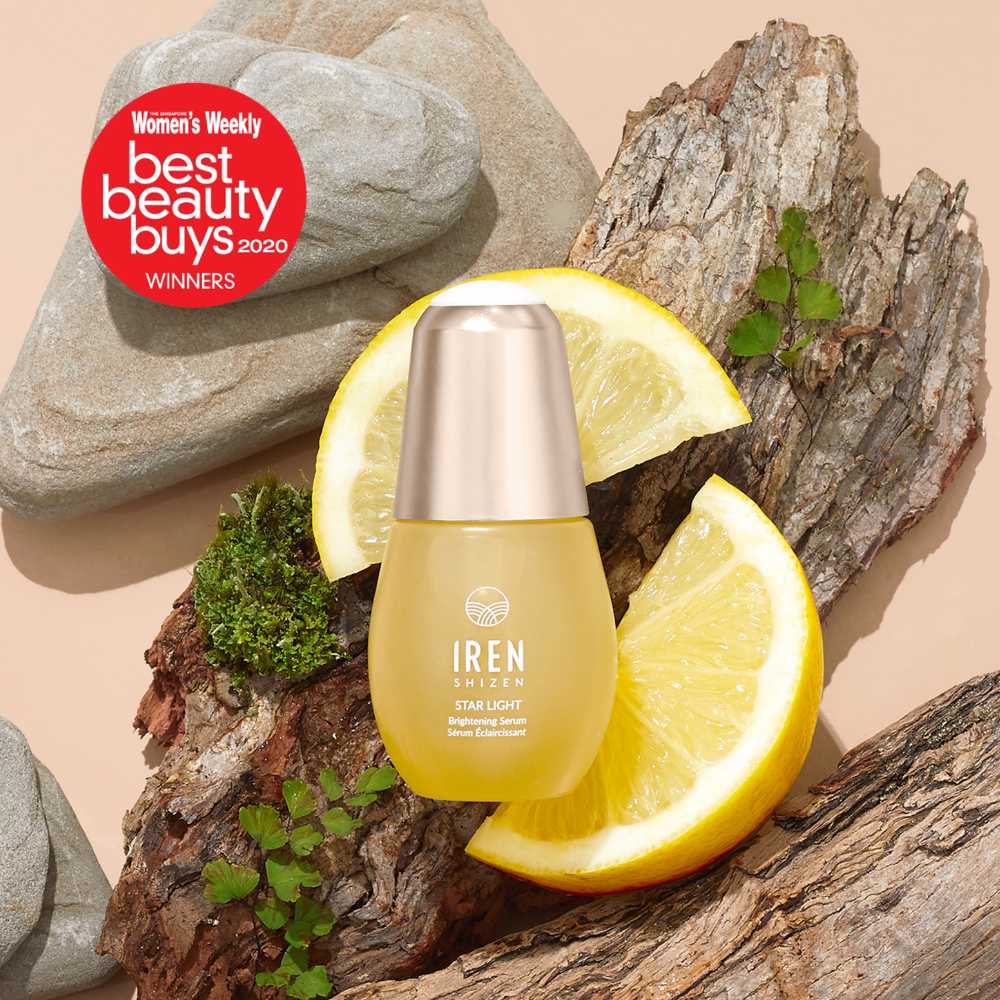 The STAR LIGHT Brightening Serum by IREN Shizen is shown on wood with lemon slices and a "Best Beauty Buys 2020" badge, emphasizing its ability to target dark spots and hyperpigmentation.