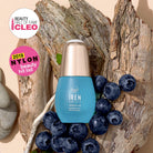 A blue bottle of IREN Shizen QUENCH-UP Hydrating Serum with hyaluronic acid is displayed on tree bark with blueberries, next to CLEO and NYLON beauty award badges. #all-groups                                                  