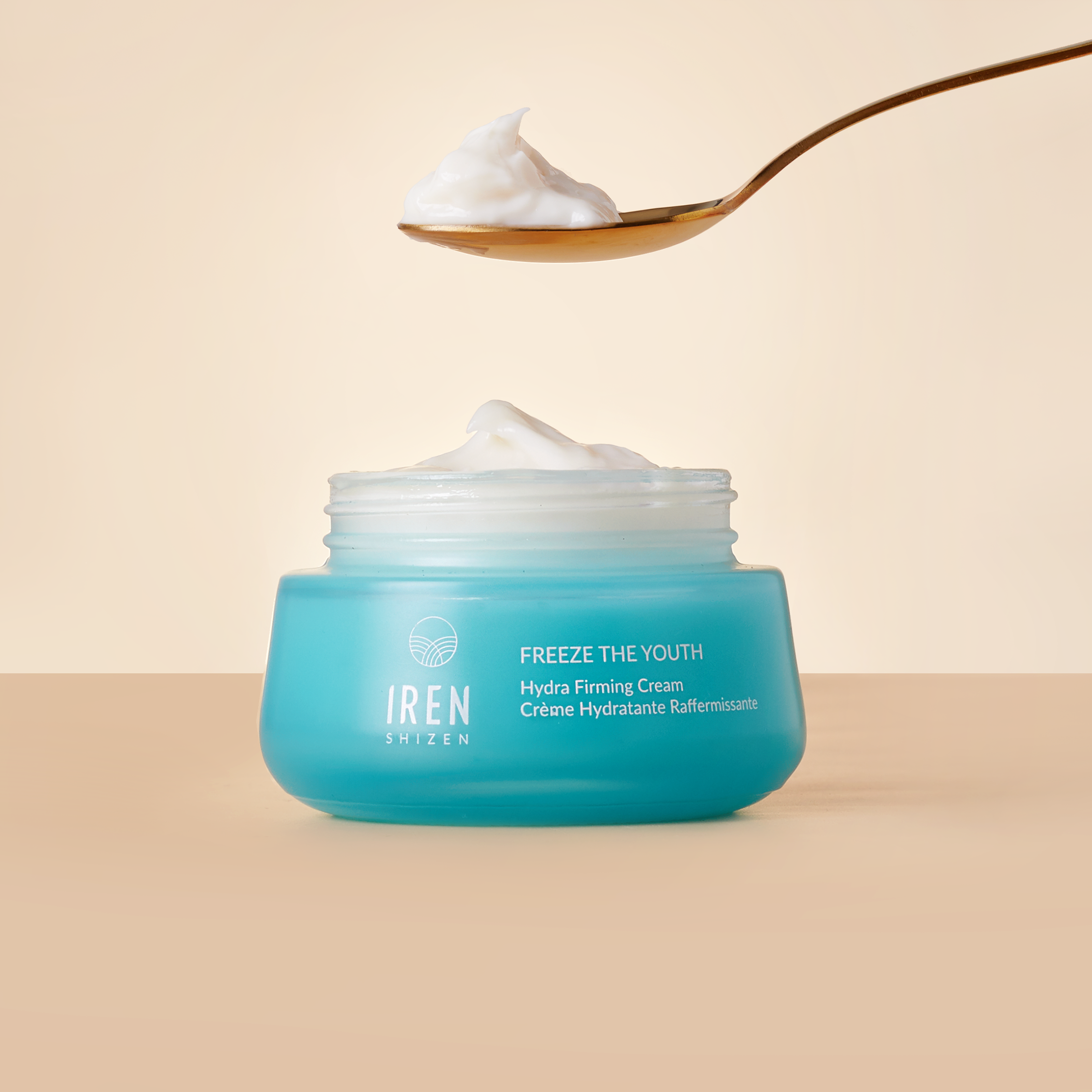 A spoon over a jar of FREEZE THE YOUTH Hydra Firming Cream from IREN Shizen. #all-groups