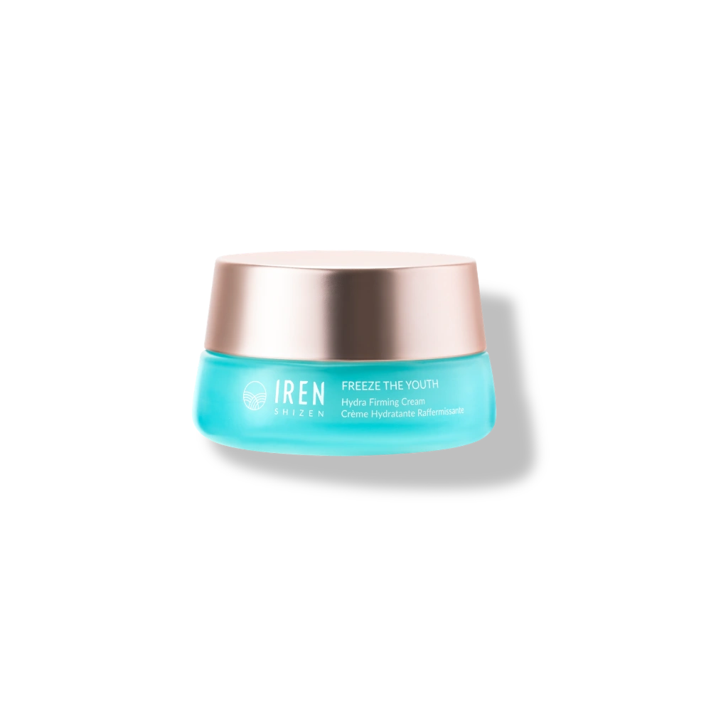 A blue jar of IREN Shizen FREEZE THE YOUTH Hydra Firming Cream with a rose gold lid is displayed on a plain white background.