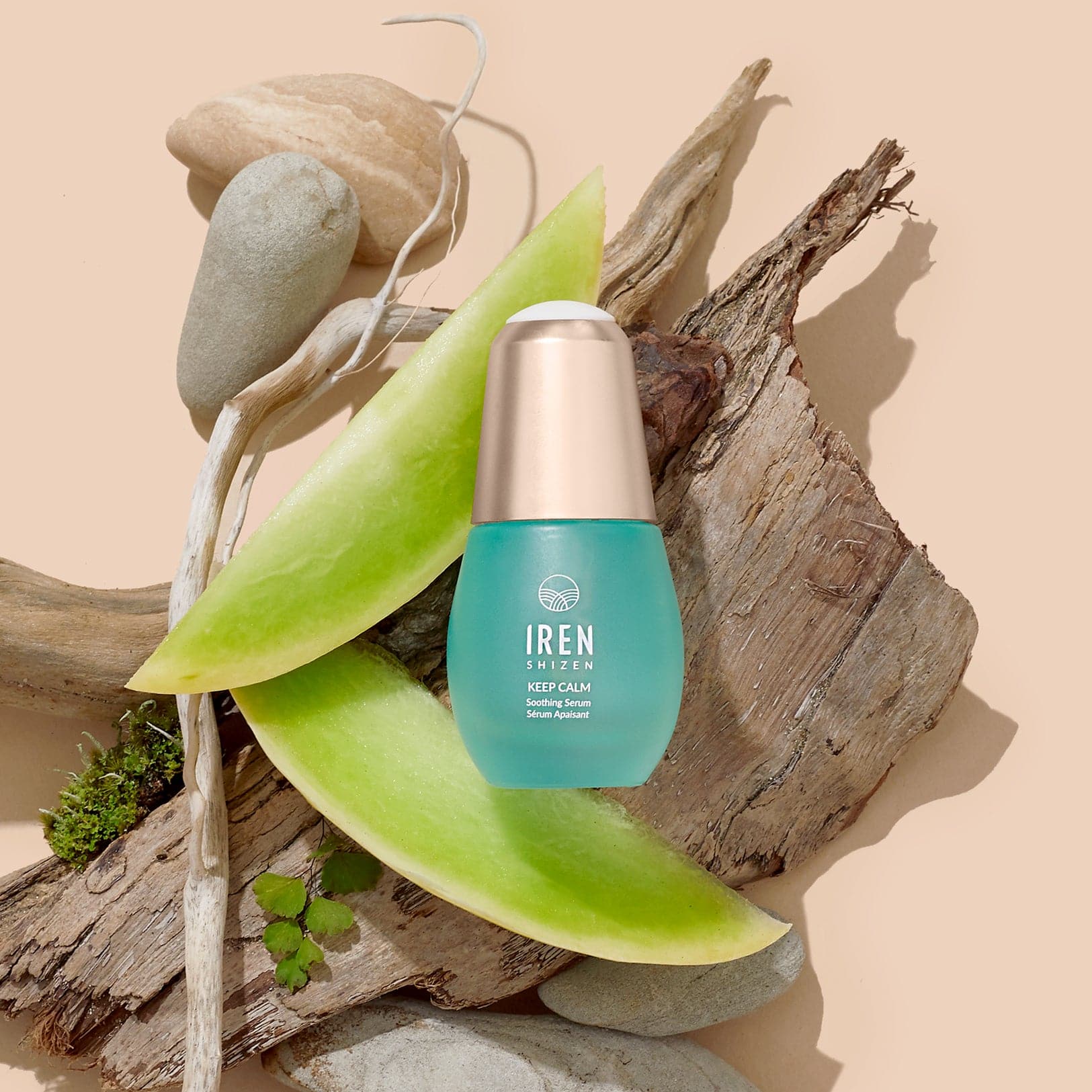 A bottle of Japanese skincare Soothing Serum by IREN Shizen on a piece of wood. #all-groups